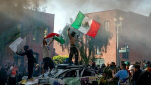 PHOTOS: Protests against immigration raids spread across the U.S. – PBS