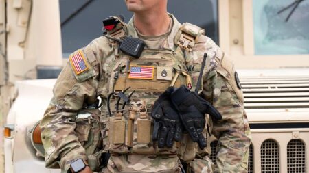 US National Guard troops begin carrying weapons in Washington, DC – Al Jazeera